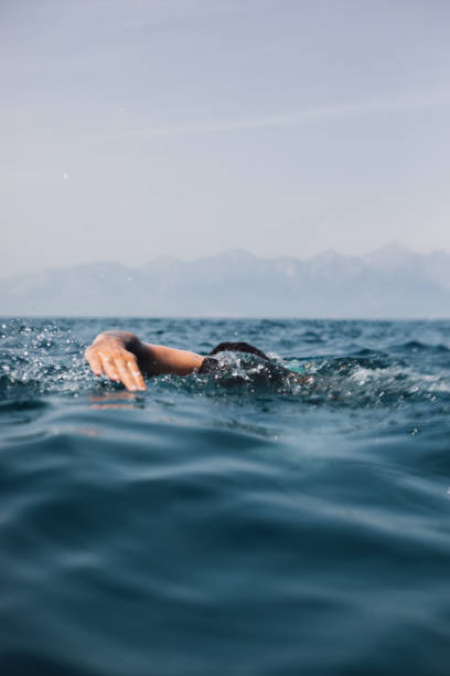 istock Man swimming in sea 1156450261