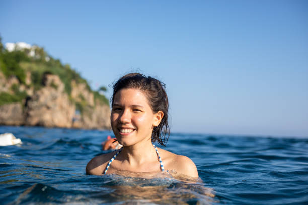 istock Woman enjoying in sea 1156452098