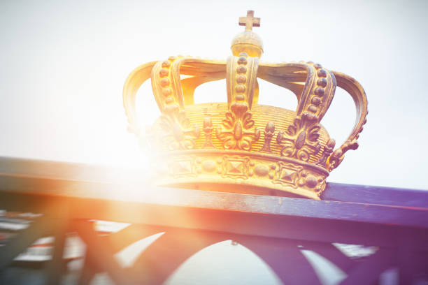 Gold coloured royal crown on bridge Skeppsholmsbron between Ostermalm and Skeppsholmen districts in central Stockholm, Sweden.
