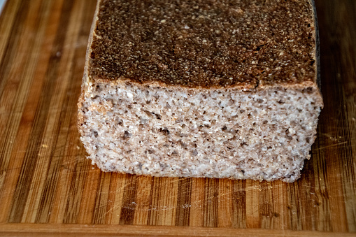 fresh fragrant homemade warm bread lying on a wooden board,