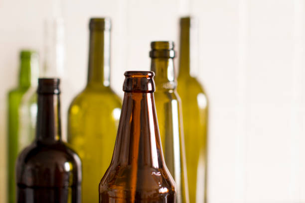 istock empty glass liquor bottles in a row 1156458322