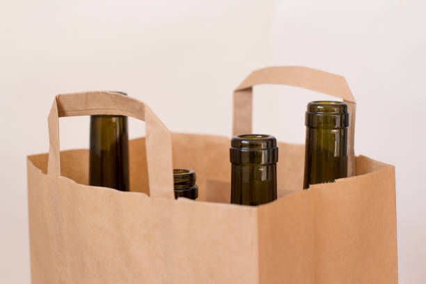 istock empty glass liquor bottles in a paper bag 1156458359