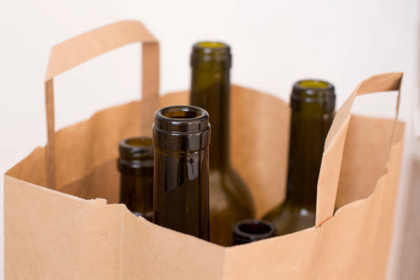 istock empty glass liquor bottles in a paper bag 1156458378