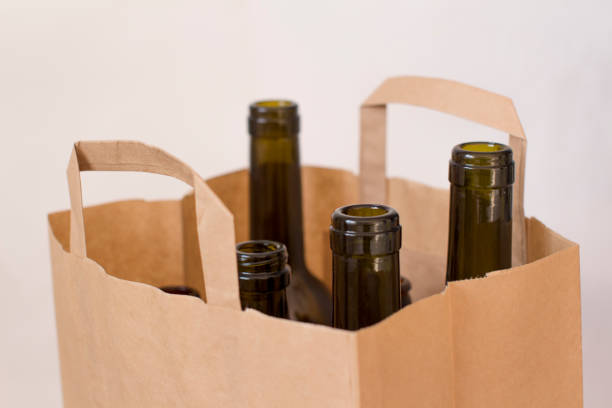 istock empty glass liquor bottles in a paper bag 1156458383