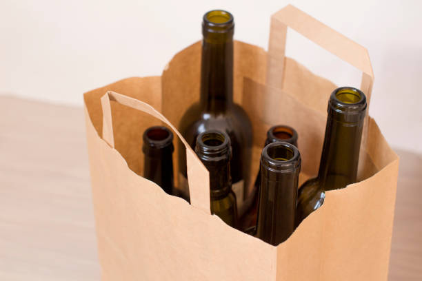 istock empty glass liquor bottles in a paper bag 1156458389