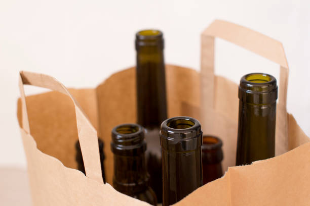 istock empty glass liquor bottles in a paper bag 1156458416