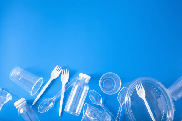 istock single use plastic bottles, cups, forks, spoons. concept of recycling plastic, plastic waste 1156460428