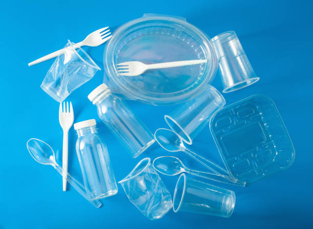 istock single use plastic bottles, cups, forks, spoons. concept of recycling plastic, plastic waste 1156461096