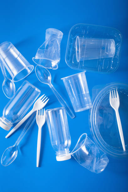 istock single use plastic bottles, cups, forks, spoons. concept of recycling plastic, plastic waste 1156461156