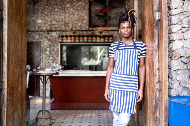 istock Afro confident business owner in front of restaurant 1156461179