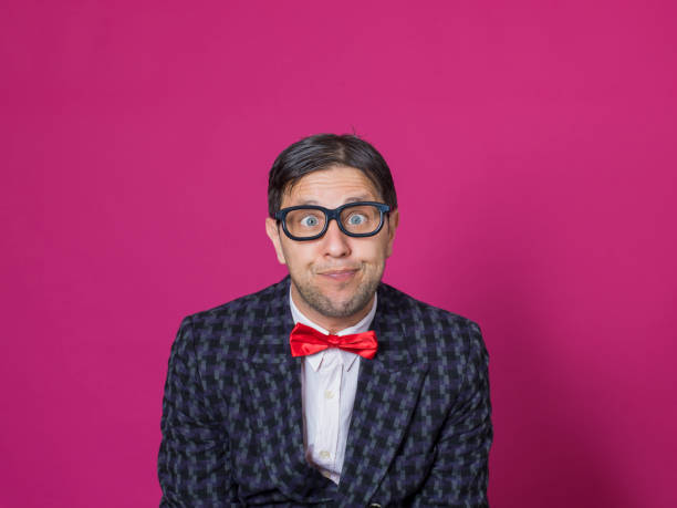 istock Nerd male portrait on pink 1156461346