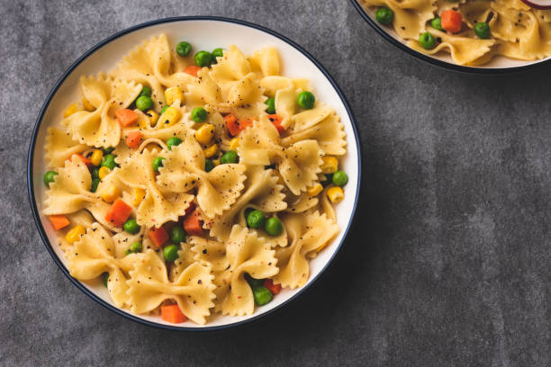 istock Pasta with vegetable food background 1156461586