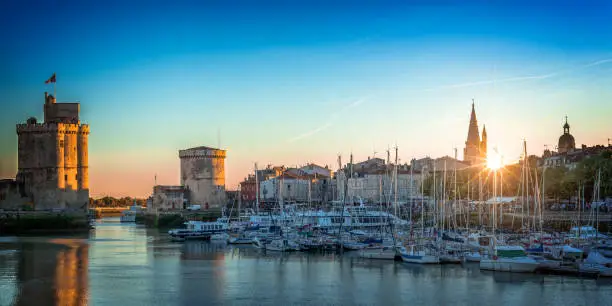 Panorama of the old harbor of La Rochelle, France at sunset