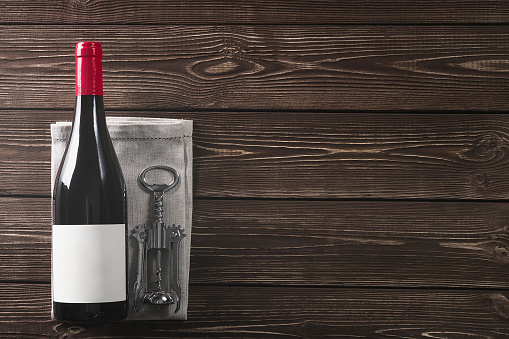 wine bottle and corkscrew. copy space.