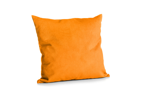 Soft orange pillow isolated on white background.