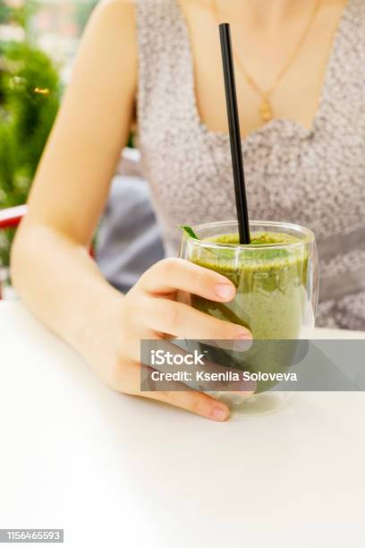 Green Juice Smoothie Healthy Drink Breakfast Shake Woman Drinking Weight Loss Food Diet Banner Hand Holding Cold Beverage Glass Stock Photo - Download Image Now