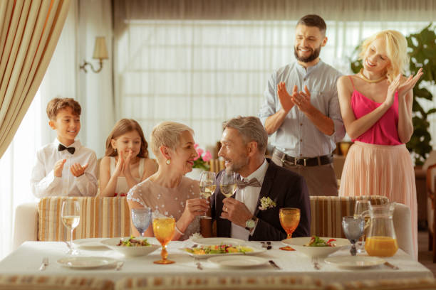 istock Children and grandchildren clapping while celebrating wedding 1156466167
