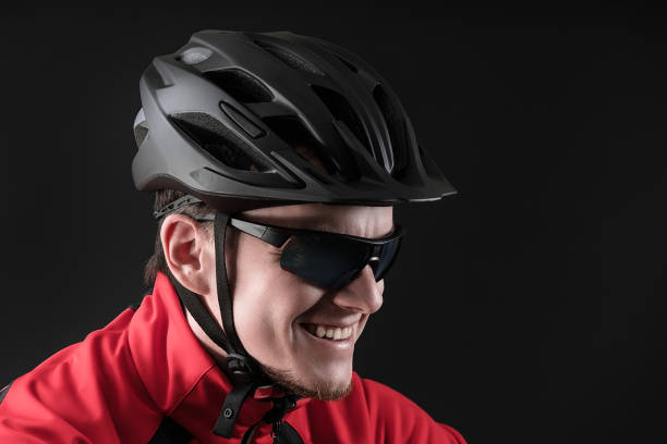 istock cycllist. young man in cycling helmet. copy space. 1156468953