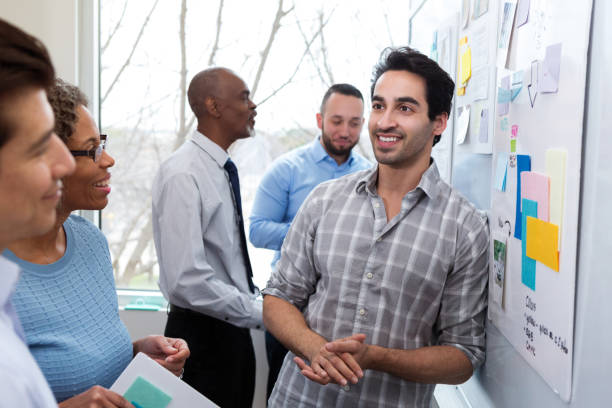 istock A mid adult man relaxes after presentation 1156472966