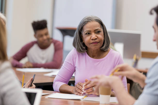 istock Diverse students of varying ages work in groups 1156473621
