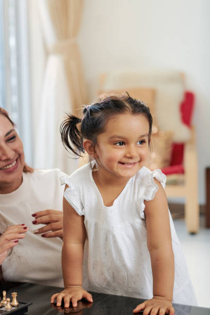 istock Little girl playing at home 1156474268