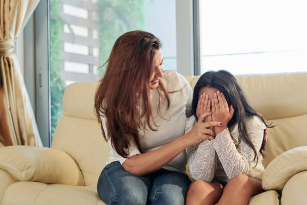 istock Mom calming her daughter 1156474283