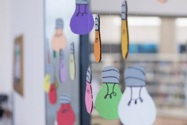 Fun, colorful hanging light bulbs decorate a classroom
