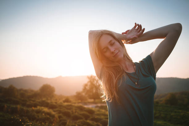 istock young carefree woman. waking up. 1156475188