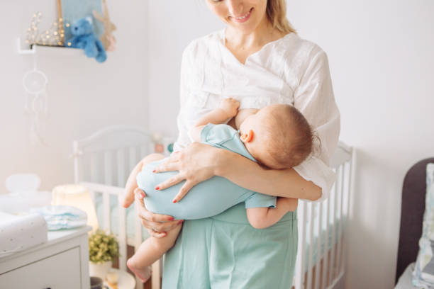istock Mother breastfeeding baby 1156476466