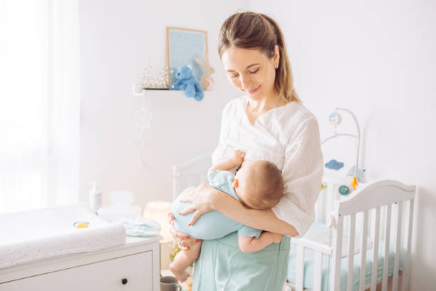 istock Mother breastfeeding baby 1156476638