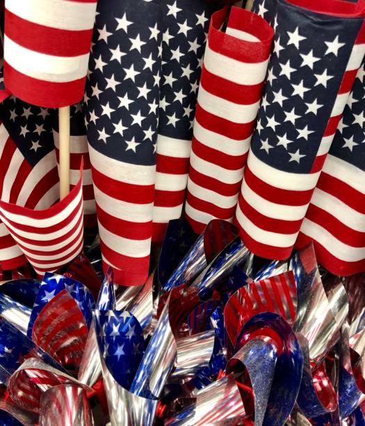 istock Group of American flags displayed for independence day 1156477551