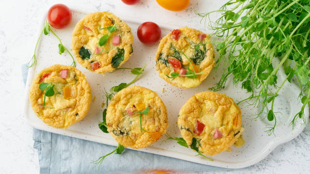 istock omelet with tomatoes and bacon, baked eggs with spinach and broccoli, top view, banner keto, ketogenic diet 1156479321