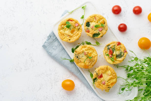 istock omelet with tomatoes and bacon, baked eggs with spinach and broccoli, top view with copy space, keto, ketogenic diet 1156479336