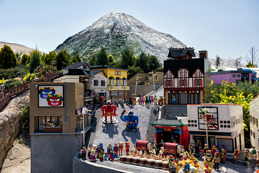 Nagoya, Japan - April 08, 2019: Lego bricks made famous Japanese Noboribetsu landmark in Hokkaido, giant demons and Jigokudani hell valley and mountain at lake toya  in Legoland miniature city.