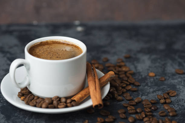 istock White Cup of espresso coffee with cinnamon on the copyspace concrete table 1156482053