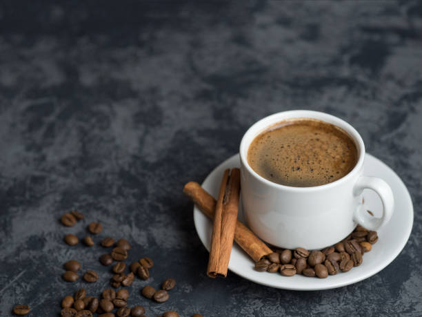 istock White Cup of espresso coffee with cinnamon on the copyspace concrete table 1156482307