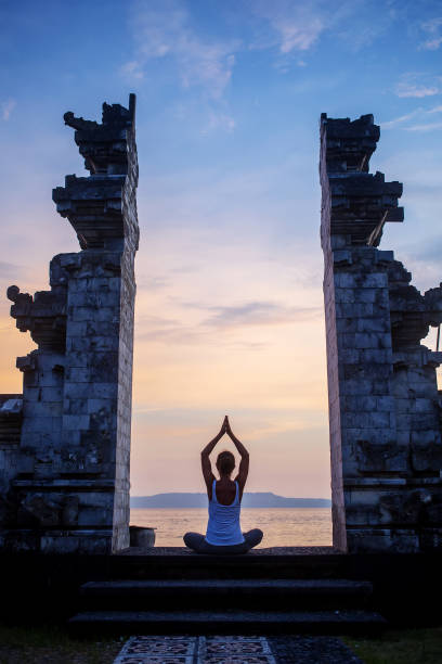 istock Caucasian woman practicing yoga at seashore 1156483184