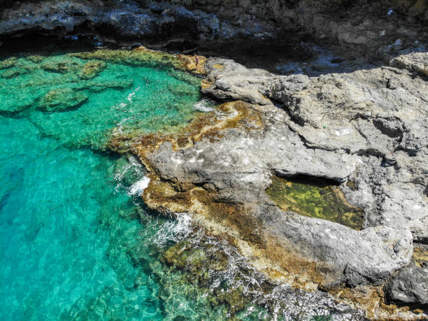 istock Woman floating in desert bay. 1156483320