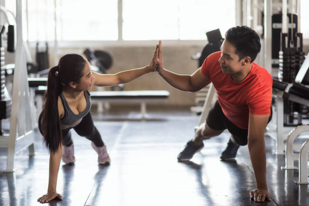istock Finess couple giving hands during sit up 1156484779