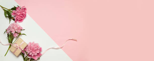 istock A bunch of peonies scattered around randomly with surprise gift boxes in boxes on a white background 1156485009