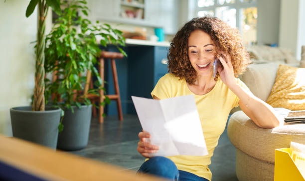 istock paying her bill by phone 1156486134