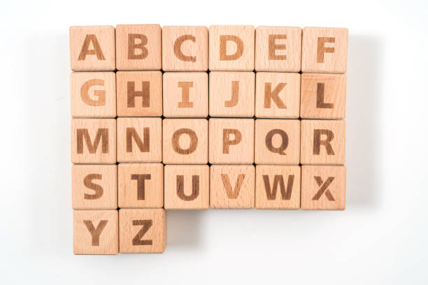 istock Alphabet on wood ,white background 1156486174