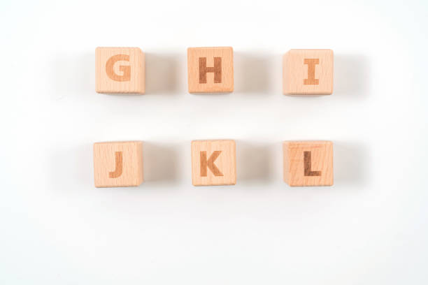 istock Alphabet on wood ,white background 1156486229