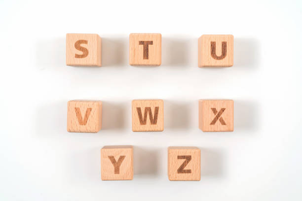 istock Alphabet on wood ,white background 1156486319
