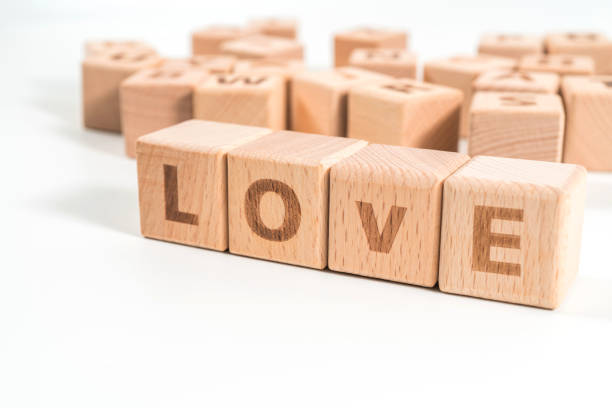 istock word LOVE on wood cube dices on white background. 1156487882