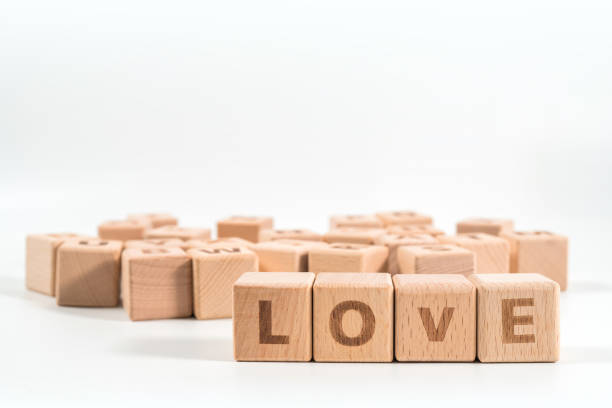 istock word LOVE on wood cube dices on white background. 1156487917