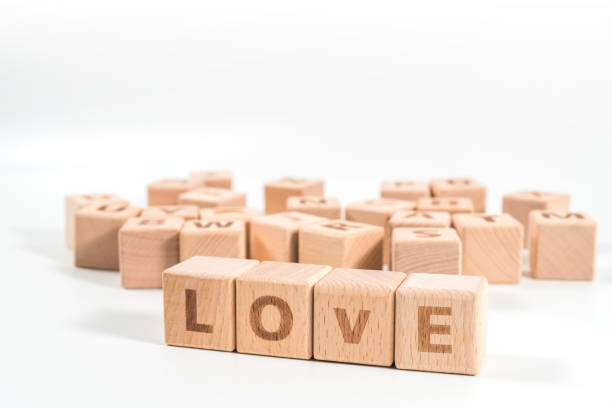 istock word LOVE on wood cube dices on white background. 1156487931