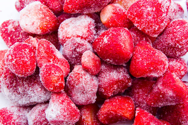istock Frozen strawberry isolated on white background 1156488933