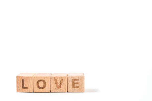 istock word LOVE on wood cube dices on white background. 1156489168