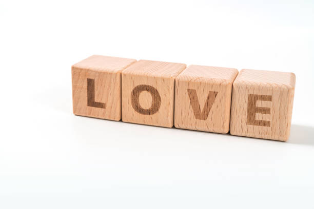 istock word LOVE on wood cube dices on white background. 1156489401
